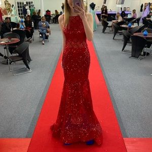 Never worn formal gown. Color is red. Size 2.